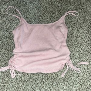 cute pink crop with ties on side. size M